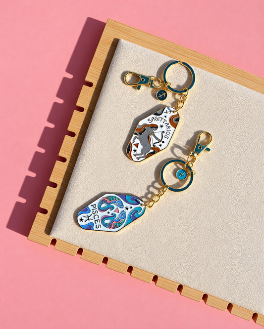 Gold zodiac keychains Sagittarius and Pisces