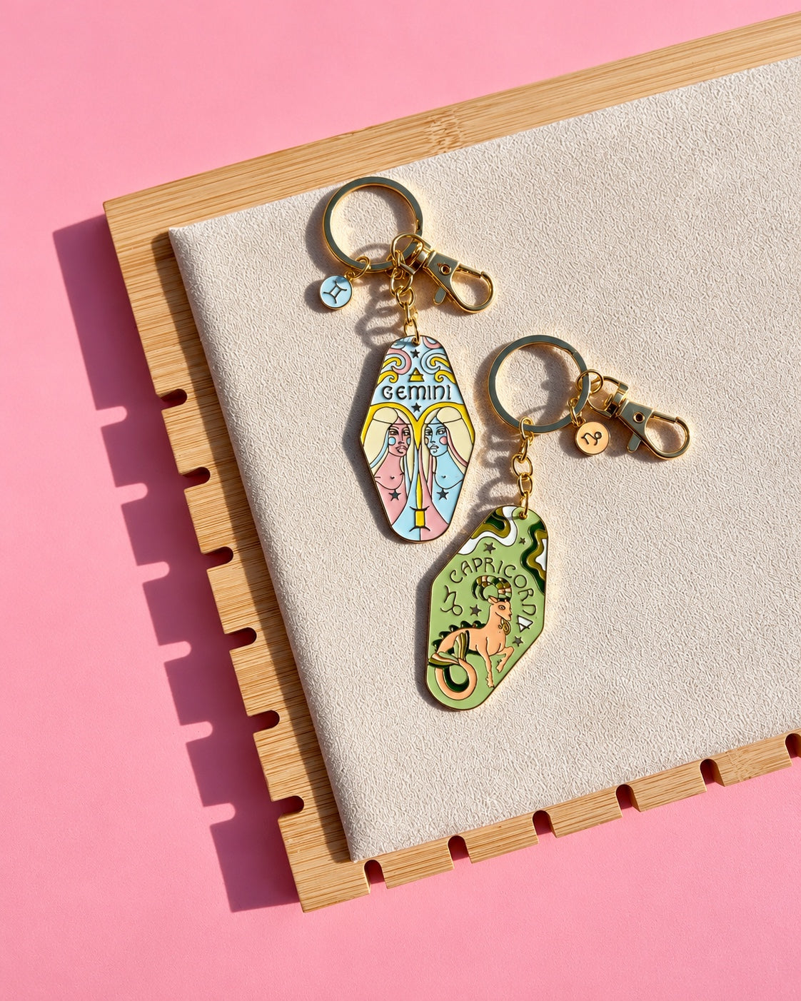 Gold zodiac keychains Gemini and Capricorn