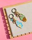 Gold zodiac keychains Aquarius and Taurus